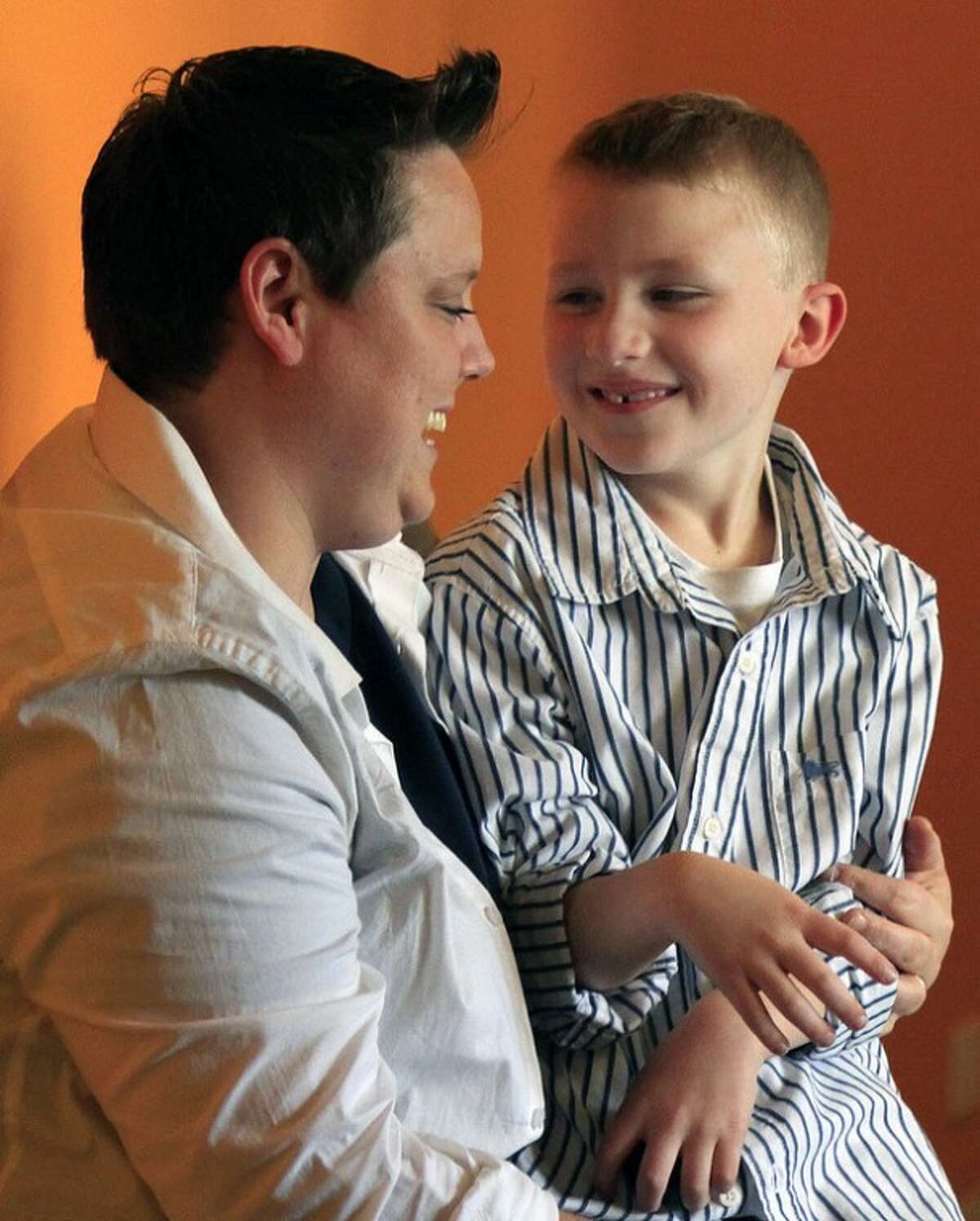 FILE - This Wednesday, April 25, 2012 photo shows Jennifer Tyrrell and her son Cruz Burns, 7, during a visit to New York. After a confidential two-year review, the Boy Scouts of America on Tuesday, July 17, 2012 emphatically reaffirmed its policy of excluding gays. Since 2000, the Boy Scouts have been targeted with numerous protest campaigns and run afoul of some local nondiscrimination laws because of the membership policy. One ongoing protest campaign involves Tyrrell, the Ohio mother of the 7-year-old Cub Scout who was ousted as a Scout den mother because she is lesbian. (AP Photo/Bebeto Matthews)