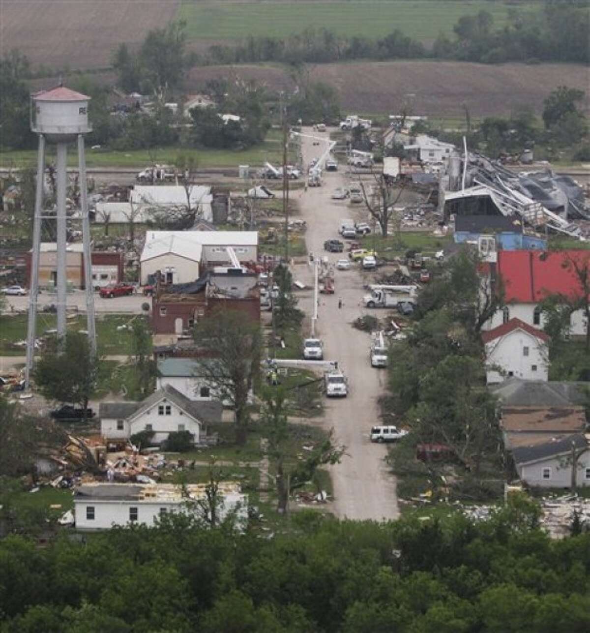 Power line repair and tornado clean up along Franklin Street in Reading, Kan., are viewed from the helicopter of Gov. Sam Brownback during a tour Monday, May 23, 2011. (AP Photo/Orlin Wagner)
