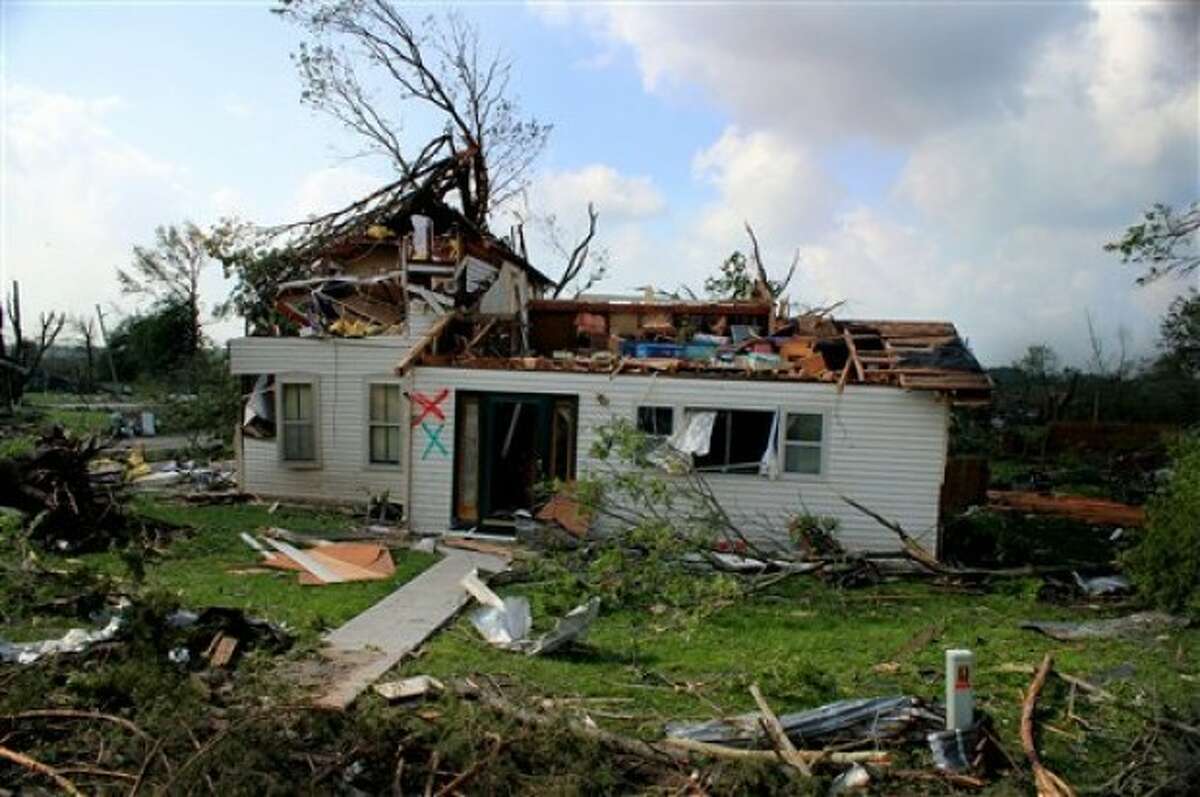 A house stands damaged in Reading, Kan., Monday, May 23, 2011. Utility crews worked Monday to restore power to the town of about 250 residents after it was struck over the weekend by a tornado with estimated winds of up to 165 mph. The storm claimed one life and caused extensive damage. (AP Photo/ Emporia Gazette, Matthew Fowler)