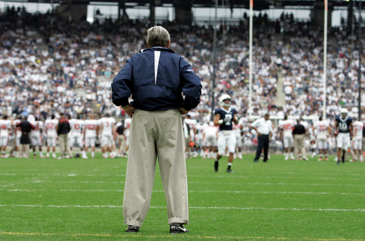 FILE - In this Sept. 6, 2008 file photo, Penn State coach Joe Paterno surveys the field before an NCAA college football game against Oregon State at Beaver Stadium in State College, Pa. NCAA president Mark Emmert says he isn't ruling out the possibility of shutting down the Penn State football program in the wake of the Jerry Sandusky child sex abuse scandal. In a PBS interview Monday night, July 16, 2012, he said he doesn't want to "take anything off the table" if the NCAA determines penalties against Penn State are warranted. (AP Photo/Carolyn Kaster, File)