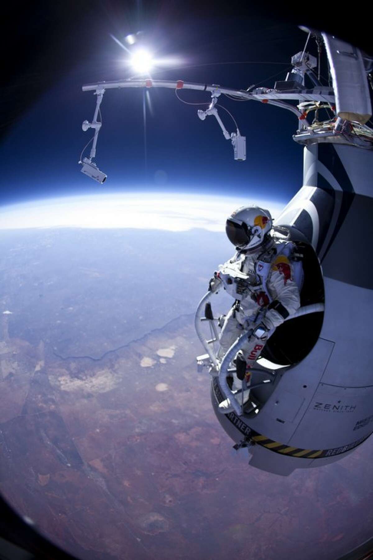 FILE - In this Thursday, March 15, 2012 photo provided by Red Bull Stratos, Felix Baumgartner prepares to jump during the first manned test flight for Red Bull Stratos over Roswell, N.M. On Wednesday, July 25, 2012, the 43-year-old Austrian plunged to Earth from an altitude of more than 18 miles landing safely near Roswell, N.M. It's was second stratospheric leap for "Fearless Felix." He's aiming for a record-breaking jump from 125,000 feet, or 23 miles, in another month. He hopes to go supersonic, breaking the speed of sound with just his body. (AP Photo/Red Bull Stratos, Jay Nemeth)
