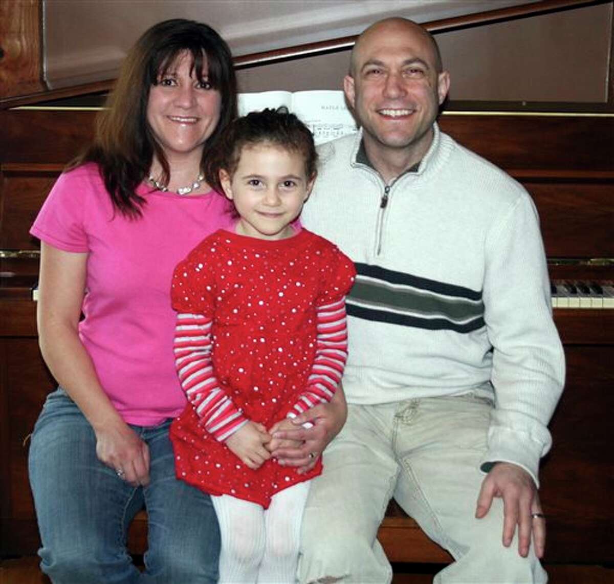 This undated photo provided by the Avielle Foundation shows Jeremy Richman, Jennifer Hensel and their daughter Avielle, 6, who was killed in the shooting massacre by Adam Lanza at Sandy Hook Elementary School in Newtown, Conn., on Dec. 14, 2012. As scientists, the couple wanted answers about what could lead a person to commit such violence. On Monday, April 15, 2013, they announced a scientific advisory board for the Avielle Foundation, which was established with the goal of reducing violence. (AP Photo/The Avielle Foundation)