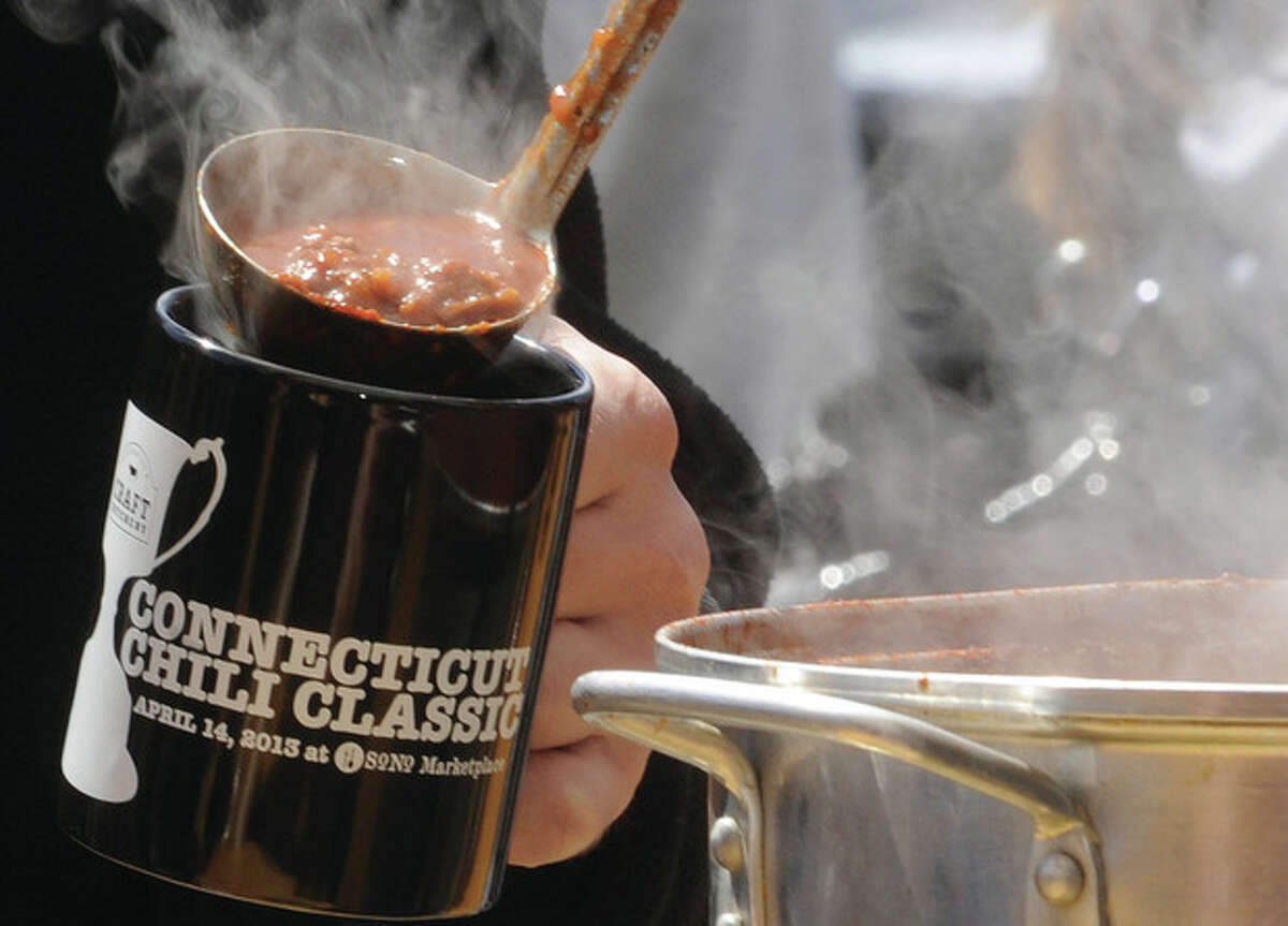 Hour photo/Matthew Vinci Chili is served Sunday at the Connecticut Chili Classic held at the SONO Market.