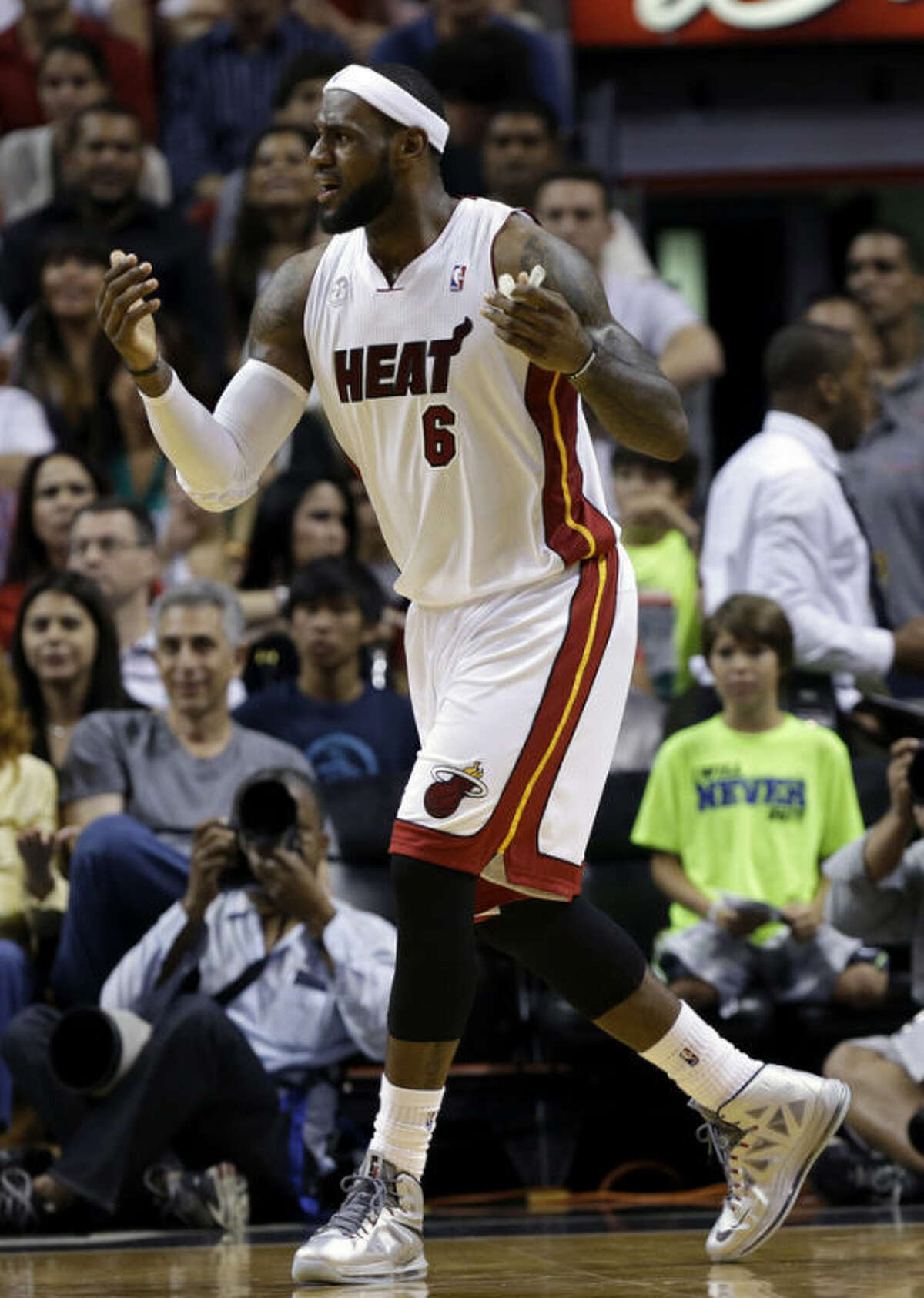 Miami Heat's LeBron James 96) reacts after being called for an offensive foul during the first half of an NBA basketball game against the Chicago Bulls Sunday April 14, 2013, in Miami. (AP Photo/Lynne Sladky)