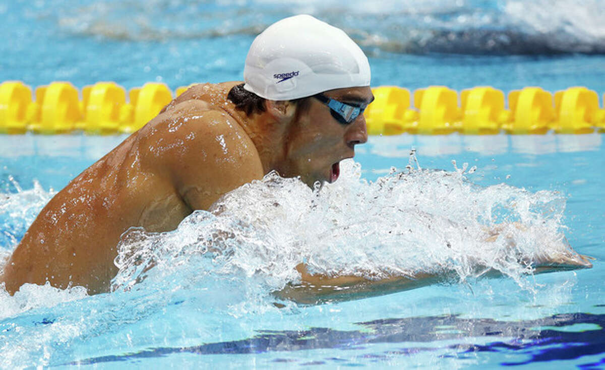 USA's Michael Phelps competes in a heat of the men's 400-meter individual medley at the Aquatics Centre in the Olympic Park during the 2012 Summer Olympics in London, Saturday, July 28, 2012. (AP Photo/Daniel Ochoa De Olza)