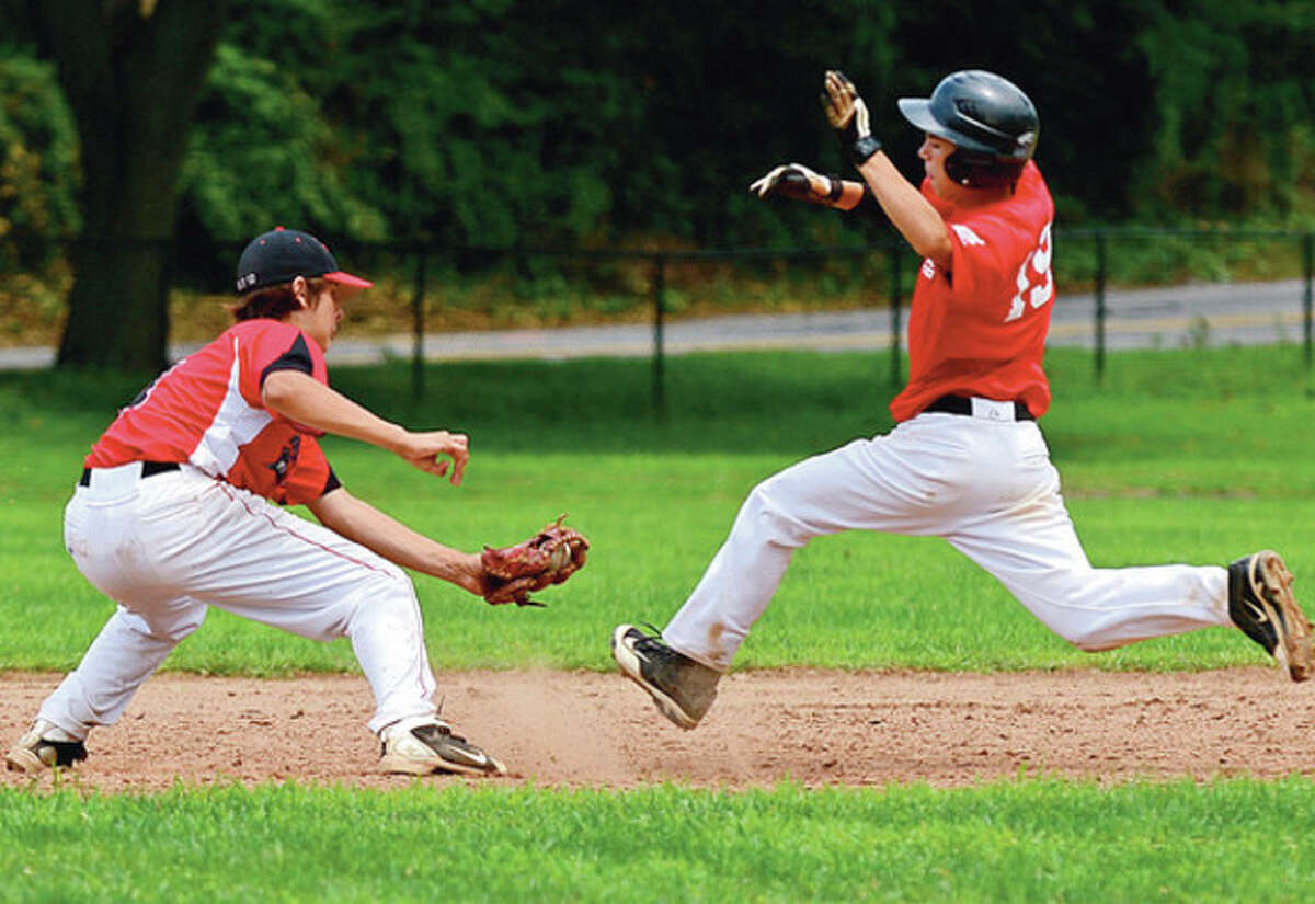 Norwalk Jr. Legion's second baseman Chjris Cotaling gets the tag on Wallingford' Andrew Colantonio during the state tournament opener Saturday. Hour photo / Erik Trautmann