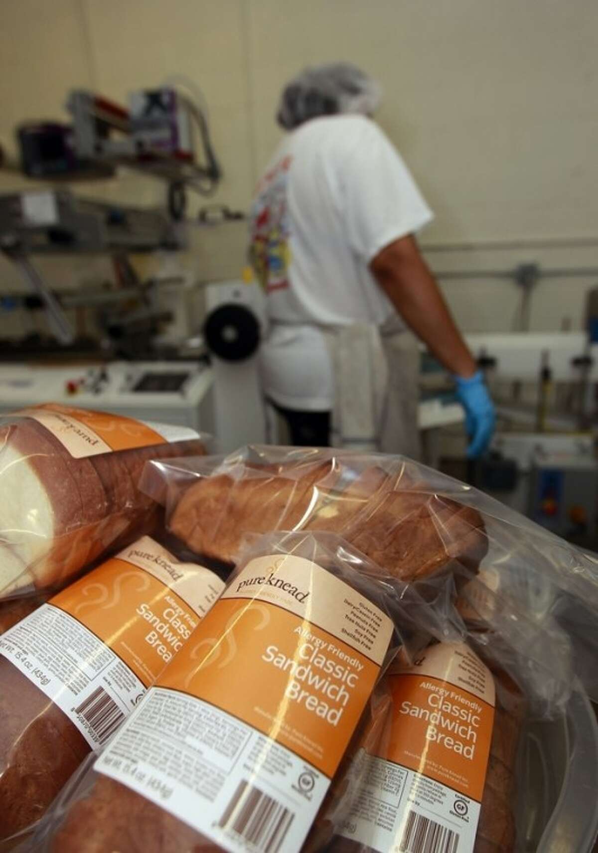 In this Thursday, July 14, 2012 photo, a worker packages gluten-free bread at Pure Knead bakery sandwich bread in Decatur, Ga. A decade ago, virtually no one in the United States seemed to have a problem eating gluten in bread and other foods. Now, millions do and spend more than $7 billion on gluten-free products. Yet, experts estimate that more than half of those consumers dont have any clear-cut reaction to gluten. (AP Photo/John Bazemore)