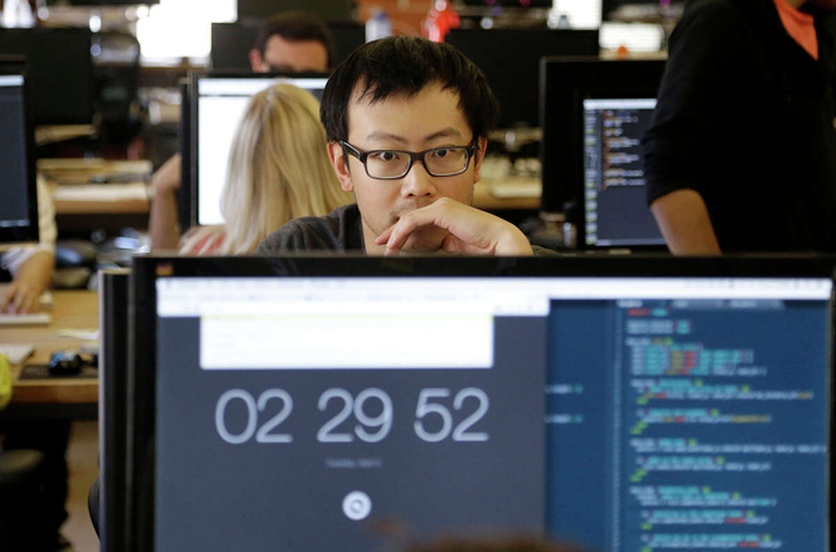 Student David Wen works during a class at Dev Bootcamp in San Francisco, Tuesday, April 2, 2013. Dev Bootcamp is one of a new breed of computer-programming schools that?’s proliferating in San Francisco and other U.S. tech hubs. These ?“hacker boot camps?” promise to teach students how to write code in two or three months and help them get hired as web developers, with starting salaries between $80,000 and $100,000, often within days or weeks of graduation. (AP Photo/Jeff Chiu)