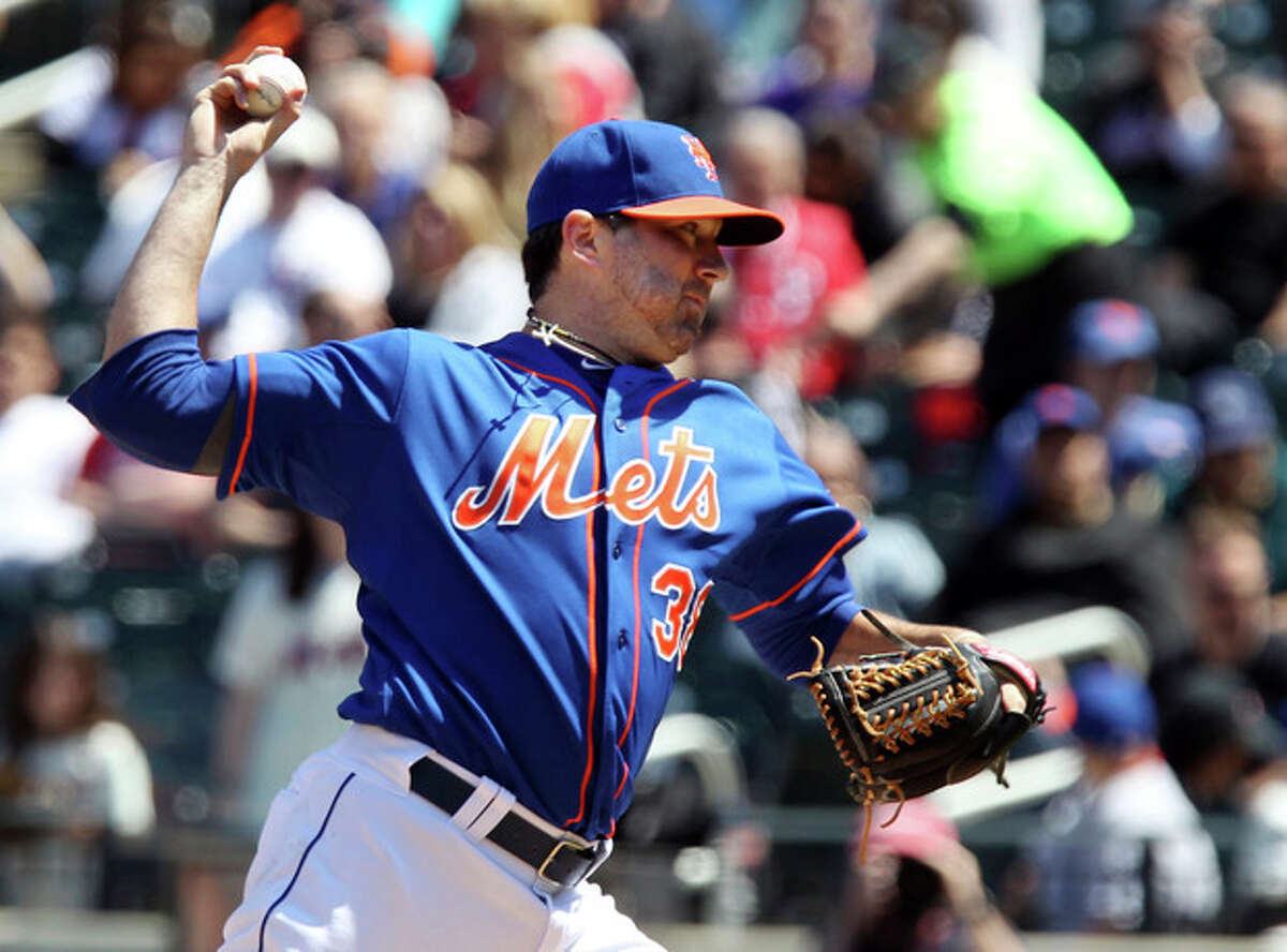 New York Mets starting pitcher Shaun Marcum throws against the Philadelphia Phillies in the first inning of a baseball game in New York on Saturday, April 27, 2013. (AP Photo/Peter Morgan)