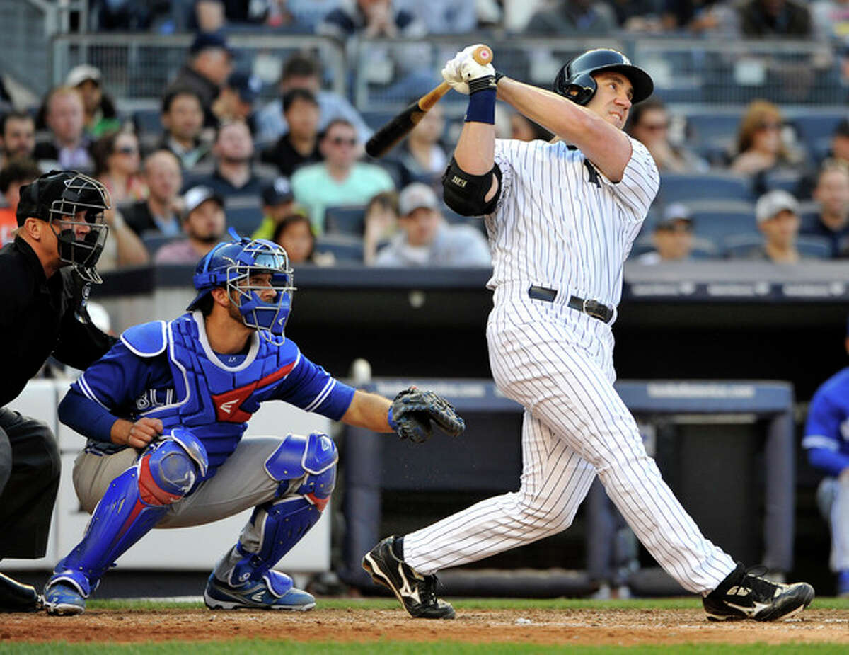 New York Yankees designated hitter Travis Hafner hits an RBI triple off of Toronto Blue Jays relief pitcher Brett Cecil in the seventh inning of a baseball game at Yankee Stadium on Saturday, April 27, 2013 in New York. Haffner hit a three-run home run in the fourth inning. (AP Photo/Kathy Kmonicek)