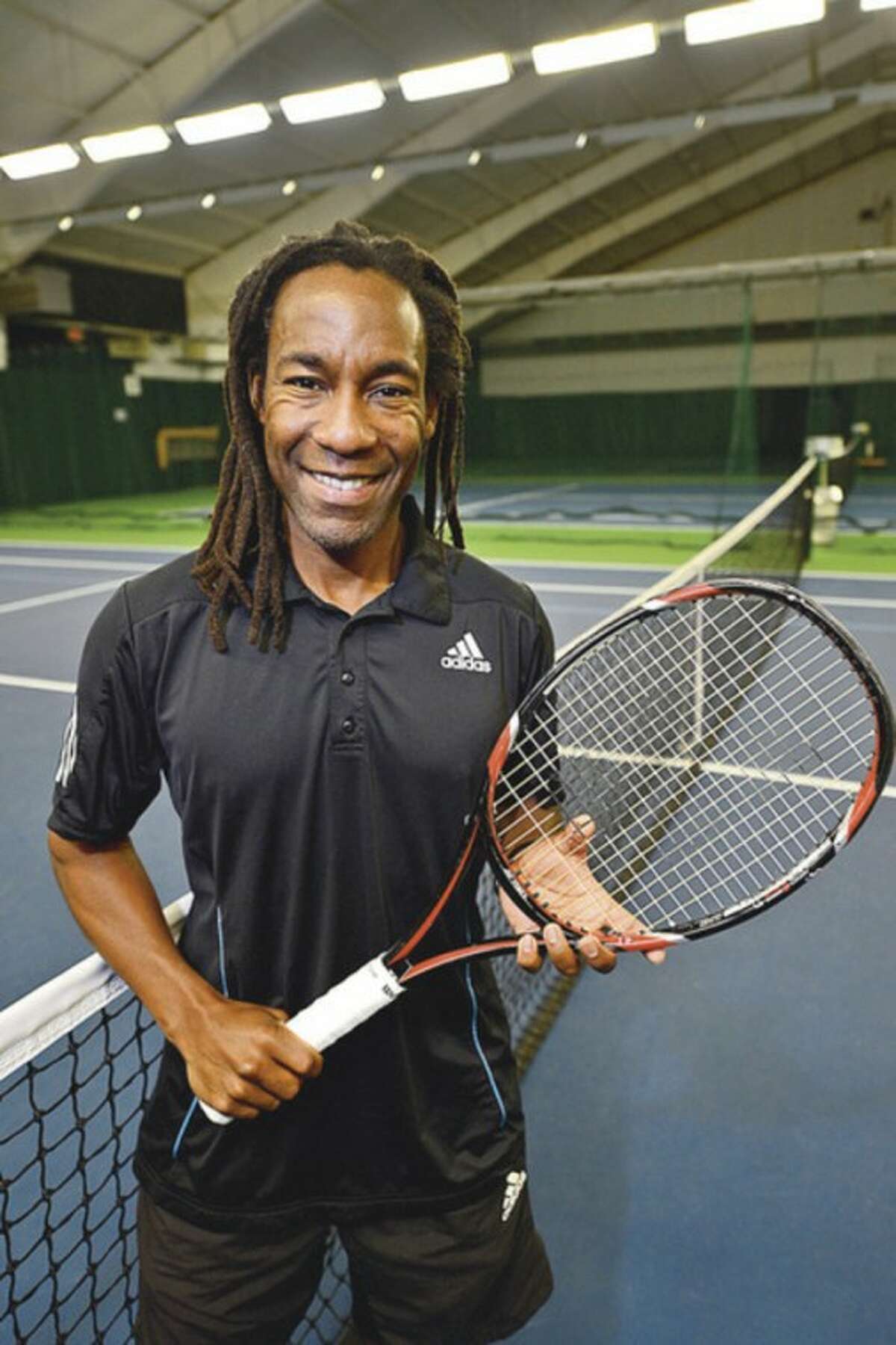 Norwalk resident Gwinyai Zengeni was recently named director of tennis at Shippan Racquet Club. Hour photo / Erik Trautmann