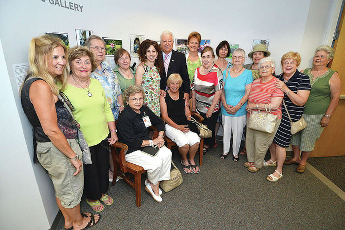 Hour Photo/Alex von Kleydorff Mayor Richard Moccia with members of the Norwalk Garden club for the opening reception of "The good deeds and beautification efforts of the Norwalk Garden Club." at The Mayors gallery