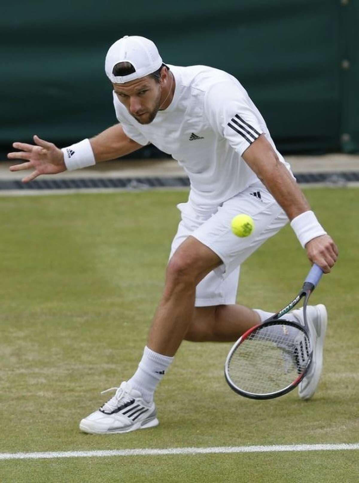Jurgen Melzer of Austria plays a return to Sergiy Stakhovsky of Ukraine during their Men's second round singles match at the All England Lawn Tennis Championships in Wimbledon, London, Friday, June 28, 2013. (AP Photo/Sang Tan)