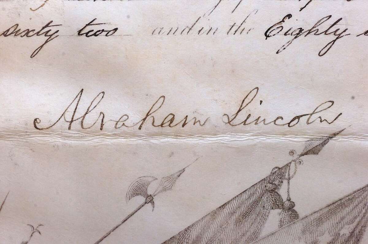Hour Photo/ Alex von Kleydorff. Signature of Abe Lincoln on a Military Commission from 1862
