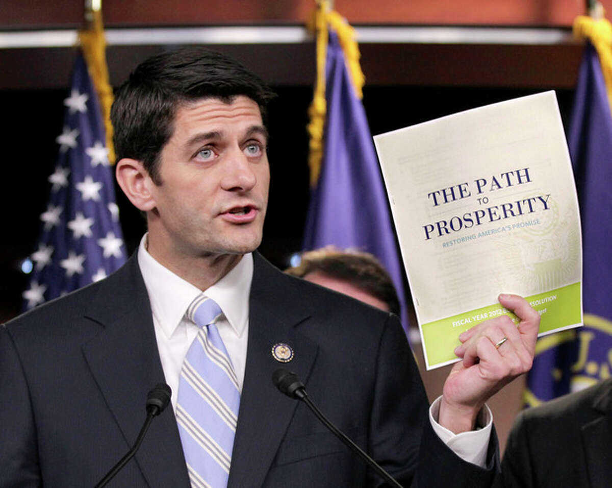 FILE - In this April 5, 2011 file photo, Republican Vice Presidential candidate, current House Budget Committee Chairman Rep. Paul Ryan, R-Wis., introduces his controversial "Path to Prosperity" budget recommendations, on Capitol Hill in Washington. Paul Ryan traveled a perilous route to political stardom. While other lawmakers nervously whistled past trillion-dollar deficits, fearing to cut popular programs, he waded in with a machete and a smile. Ryan wants to slice away at Medicare, Social Security, food stamps and virtually every other government program but the military. (AP Photo/J. Scott Applewhite, File)