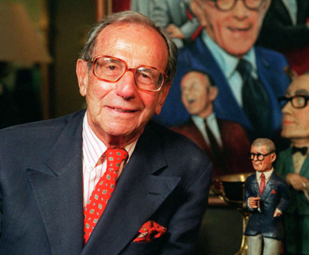 FILE - This Oct. 6, 1996 file photo shows Irving Fein, long time manager of the late George Burns, standing near memorabilia up for auction at Sotheby's, in Beverly Hills, Calif. Fein, a producer and manager who steered the careers of George Burns and Jack Benny and nicknamed actress Lana Turner "the Sweater Girl," died Aug. 10, 2012 of an age-related illness. He was 101. (AP Photo/Frank Wiese, file)