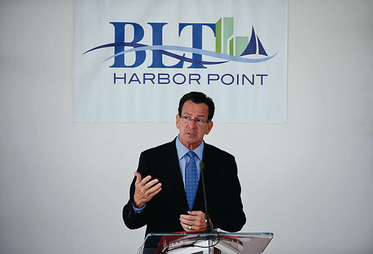 Governor Dannel Malloy speaks during a press event announcing the move of Bridgewater Associates to Building and Land Management's Harbor Point development in Stamford Wednesday. Hour photo / Erik Trautmann