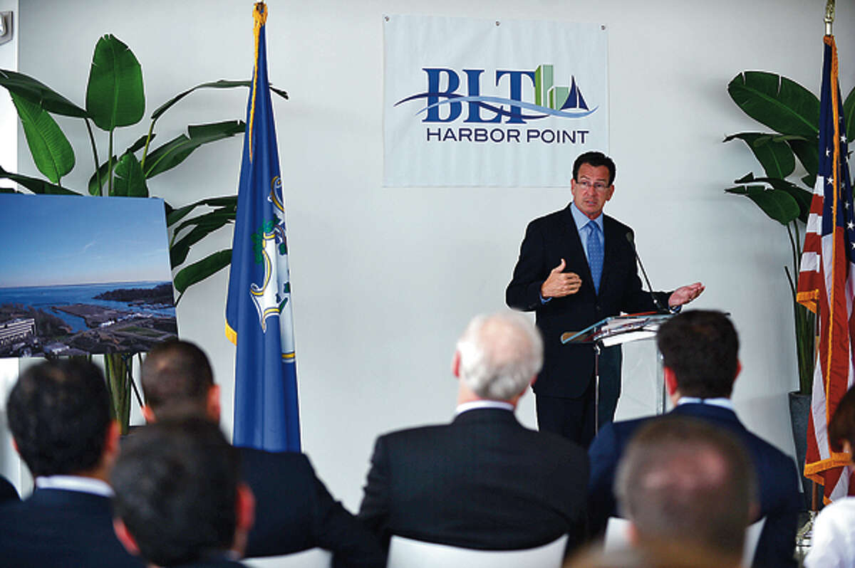 Governor Dannel Malloy speaks during a press event announcing the move of Bridgewater Associates to Building and Land Management's Harbor Point development in Stamford Wednesday. Hour photo / Erik Trautmann
