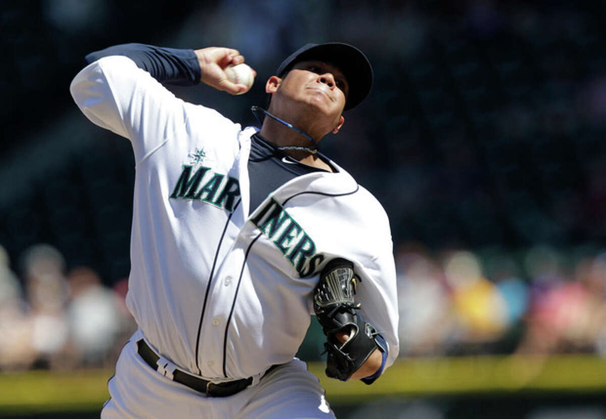 Seattle Mariners starting pitcher Felix Hernandez throws against the Tampa Bay Rays in the fifth inning of a baseball game on Wednesday, Aug. 15, 2012, in Seattle. (AP Photo/Ted S. Warren)