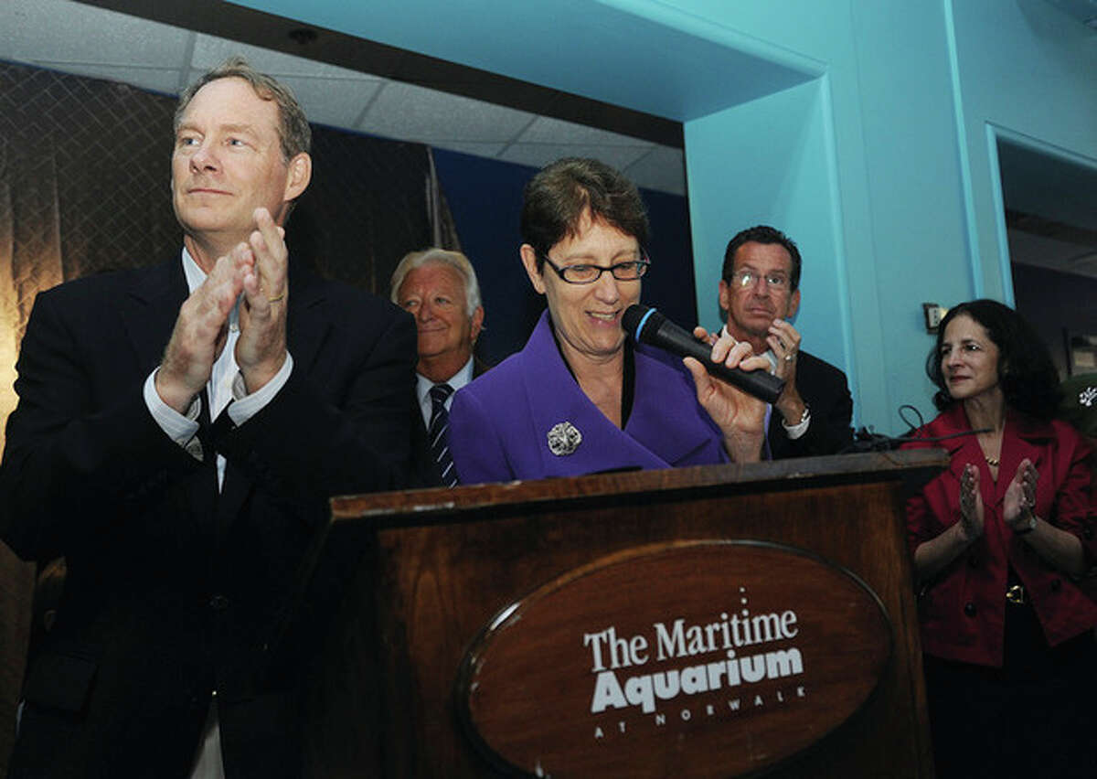 Hour photos / Matthew Vinci Jennifer Herring, president of The Maritime Aquarium at Norwalk, speaks as Robert Rohn, vice chairman and chairman of the executive committee, applauds during the Aquarium's 25th-anniversary celebration on Tuesday.
