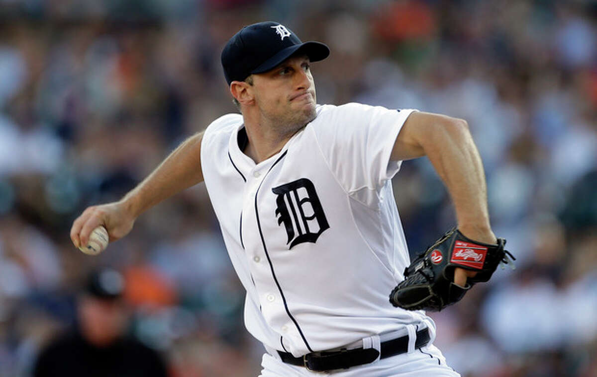 Detroit Tigers starting pitcher Max Scherzer throws during the first inning of a baseball game against the Texas Rangers in Detroit, Saturday, July 13, 2013. (AP Photo/Carlos Osorio)