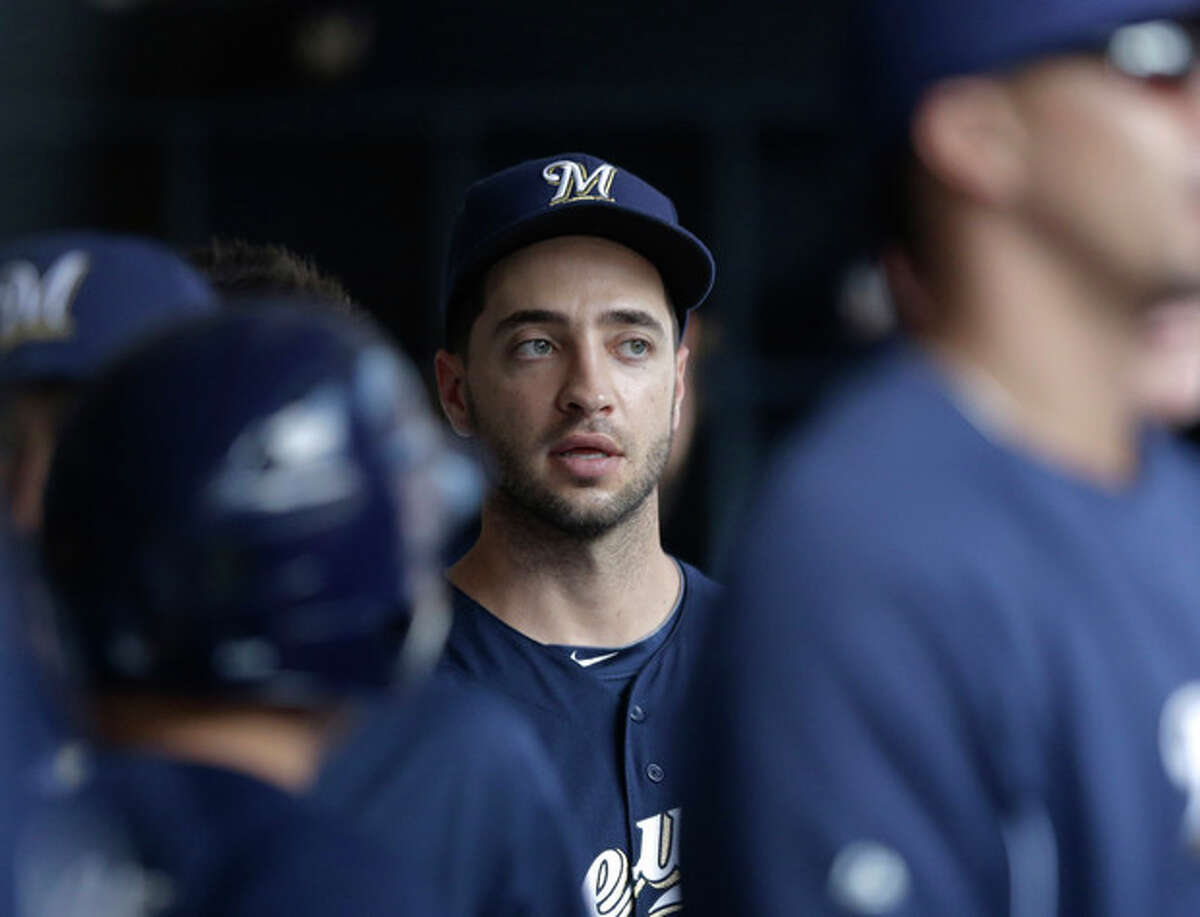 Milwaukee Brewers' Ryan Braun is seen in the dugout during the first inning of a baseball game against the Cincinnati Reds Wednesday, July 10, 2013, in Milwaukee. (AP Photo/Morry Gash)