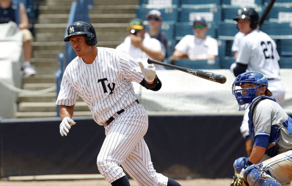 New York Yankees' Alex Rodriquez drops the bat as he heads for first with a single in the sixth inning for the Tampa Yankees against the Dunedin Blue Jays in a minor league baseball rehab game in Tampa, Fla., Wednesday, July 10, 2013. (AP Photo/Scott Iskowitz)