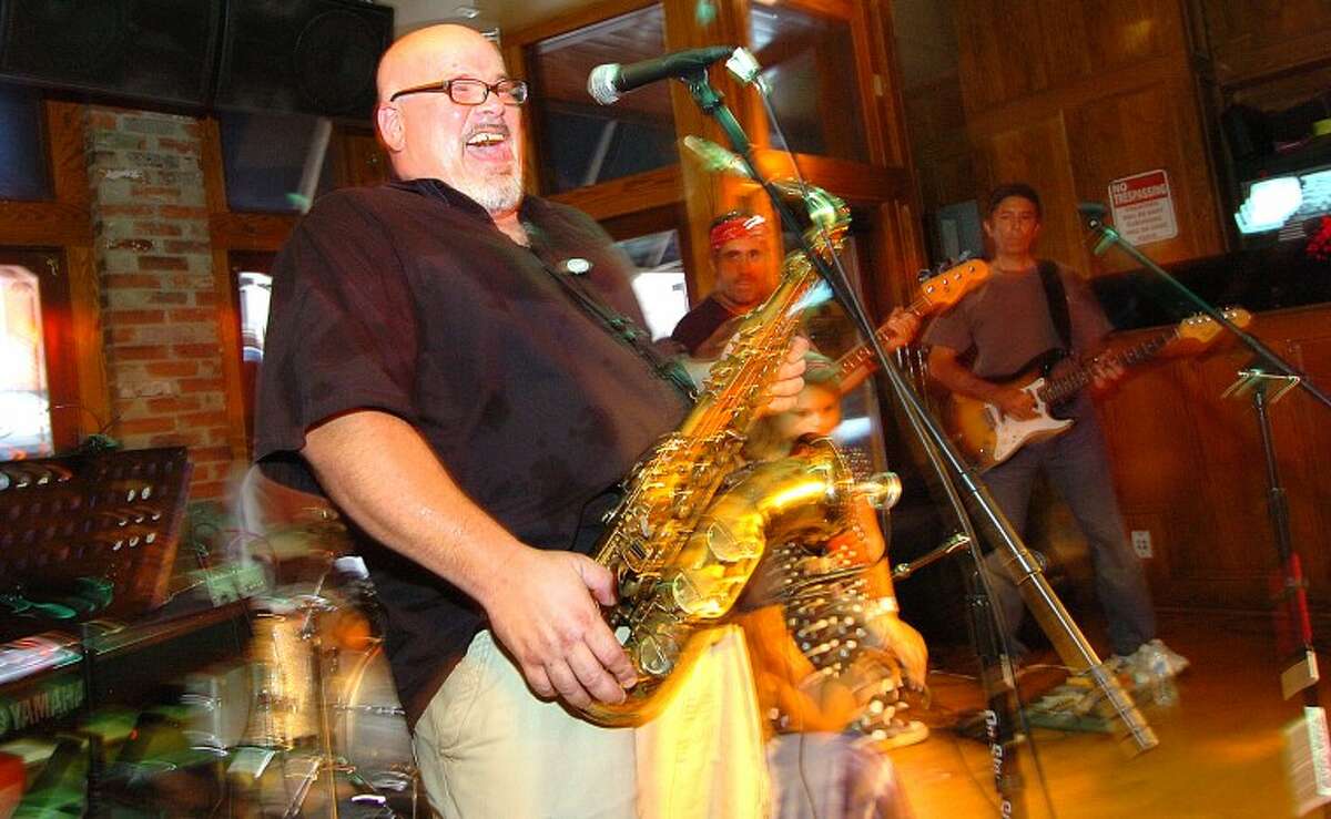 Hour Photo/ Alex von Kleydorff. Steve DeFalla on Saxaphone belts out lyrics with the band Juicy Grapes at Black Bear Saloon during the Hour's Newspapers Breaking The Band Battle in SONO Friday night