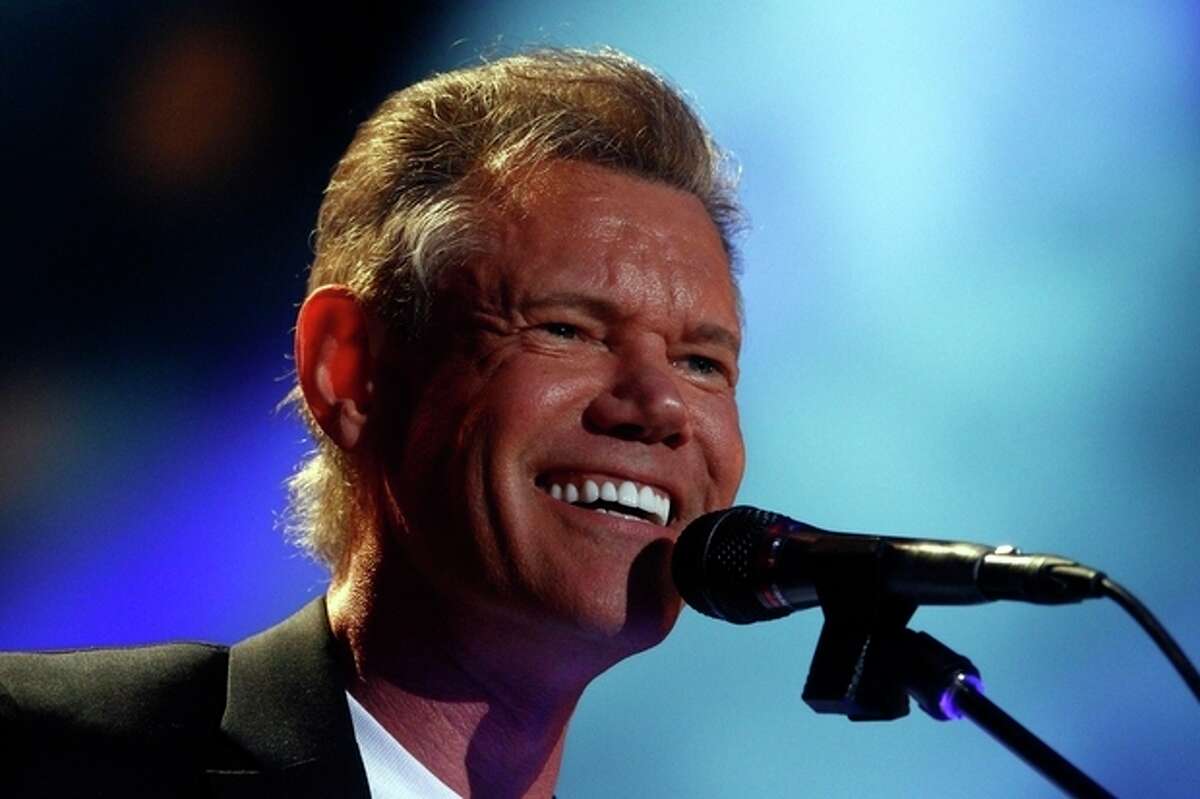 FILE - In this June 7, 2013 file photo, Randy Travis performs on day 2 of the 2013 CMA Music festival at the LP Field in Nashville, Tenn. Publicist Kirt Webster on Wednesday night, July 10, 2013 said that the 54-year-old Travis is in surgery after suffering a stroke while he was being treated for congestive heart failure because of a viral illness. (Photo by Wade Payne/Invision/AP, File)