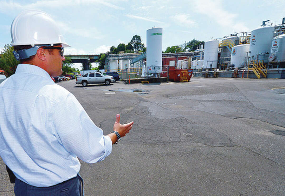 Hour photo / Erik Trautmann Bob King, manager of operations for King Industries, talks about the safety precautions the solvent plant takes against leaks and fire.