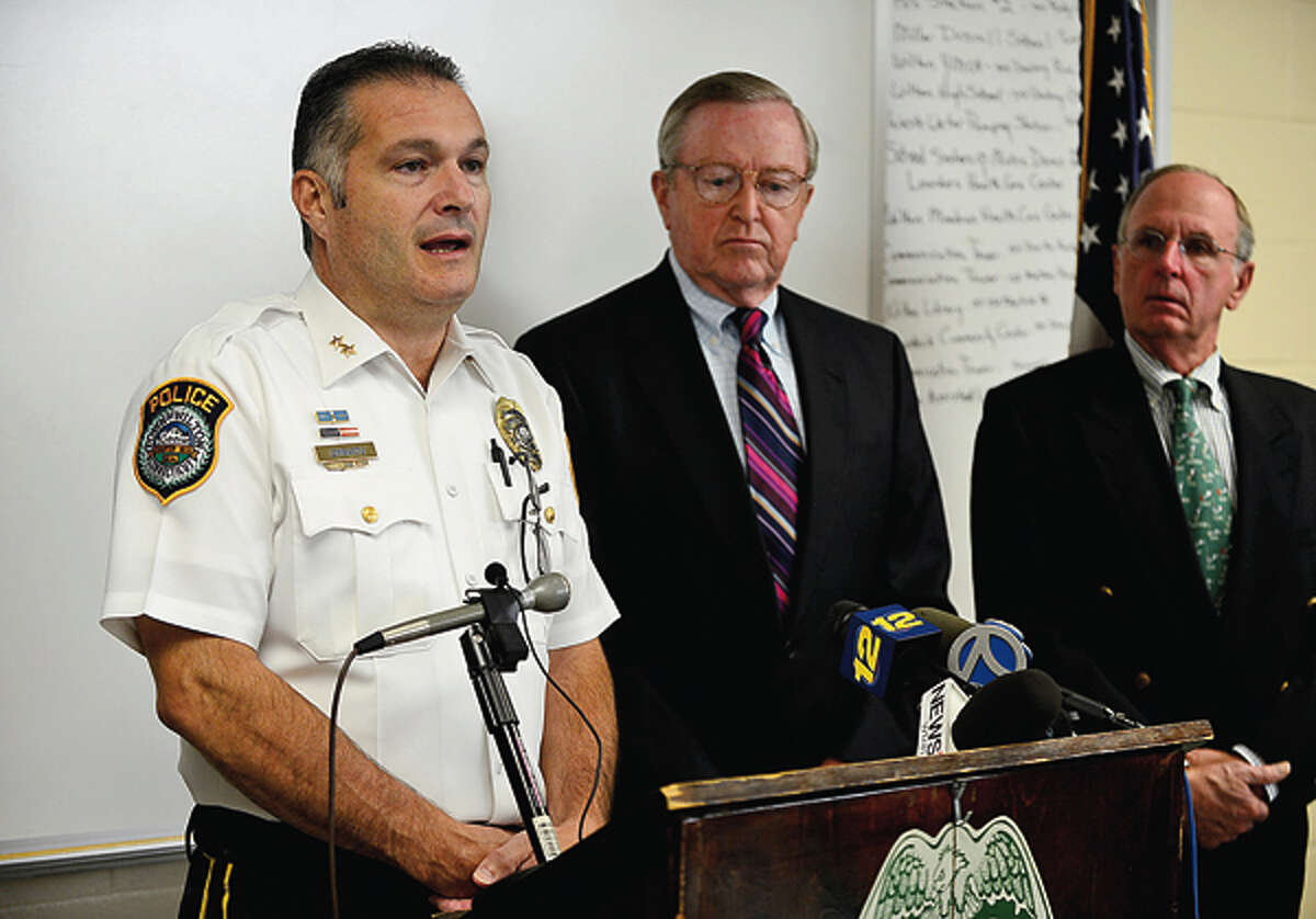 Wilton Police Chief Michael Lomabardo holds a press conference with first selectman Bill Brennan and police commisioners including Donald Sauvigne to announce an arrest in the Nick Parisot killing. Hour photo / Erik Trautmann