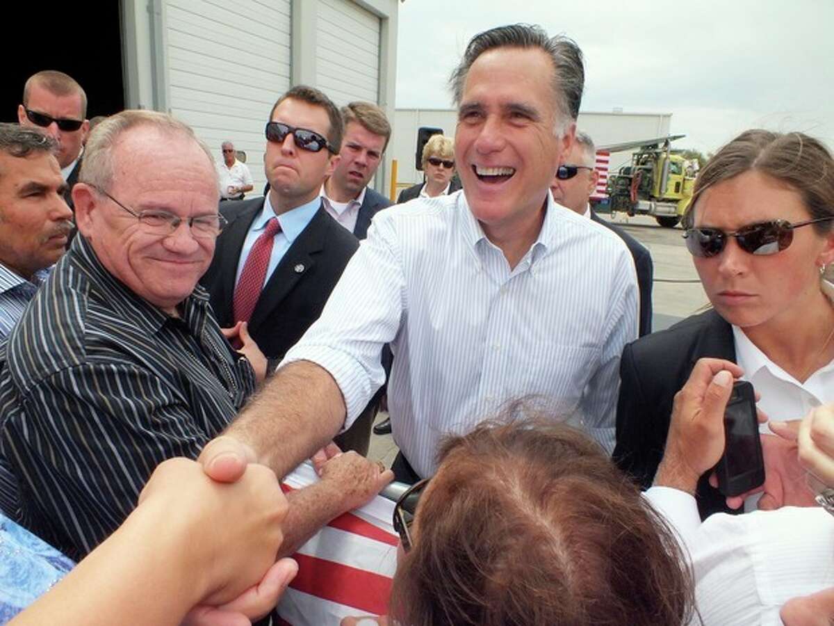 Republican presidential candidate, former Massachusetts Gov. Mitt Romney shakes hands during a campaign event at Watson Truck and Supply, Thursday, Aug. 23, 2012, in Hobbs, N.M. (AP Photo/Hobbs News-Sun, Todd Bailey)