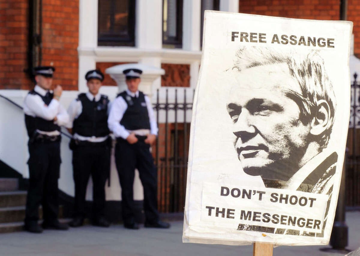 A pro-Julian Assange placard is seen outside the Embassy of Ecuador, in central London, Saturday August 18, 2012, where Wikileaks founder Julian Assange is claiming asylum in an effort to avoid extradition to Sweden. Authorities in Sweden want to question Assange over allegations made by two women who accuse him of sexual misconduct during a visit to the country in mid-2010, but Assange asserts that the US will try to extradite him from Sweden to answer allegations relating to the WikiLeaks publication of US secrets. (AP Photo / Dominic Lipinski/PA) UNITED KINGDOM OUT - NO SALES - NO ARCHIVES