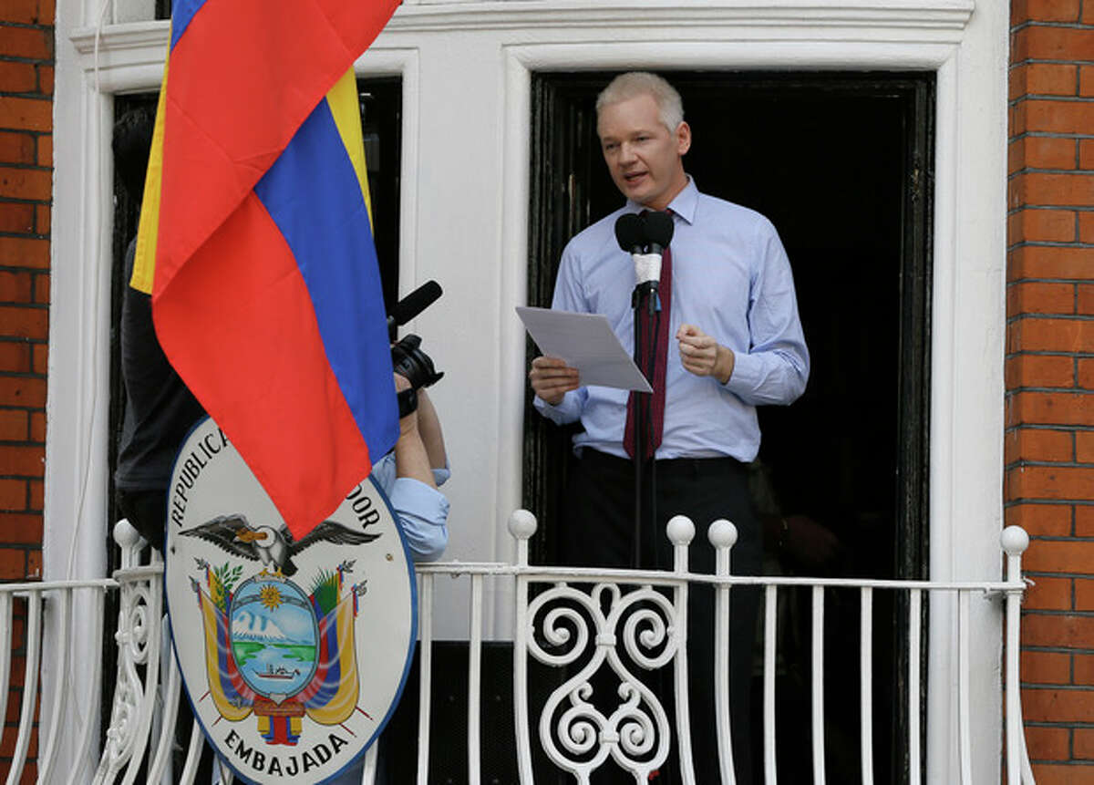 Julian Assange, founder of WikiLeaks makes a statement from a balcony of the Equador Embassy in London, Sunday, Aug. 19, 2012. Assange called on United States President Barack Obama to end a "witch hunt" against the secret-spilling WikiLeaks organization.(AP Photo/Kirsty Wigglesworth)