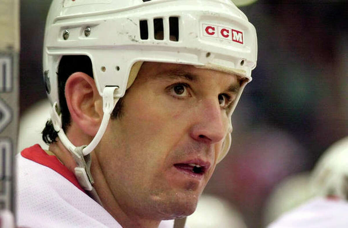 FILE - This Nov. 27, 2001 file photo shows Detroit Red Wings' Brendan Shanahan looking out from the bench during an NHL game with the Calgary Flames at the Joe Louis Arena in Detroit. Defensemen Scott Niedermayer and Chris Chelios, along with forward Brendan Shanahan have been picked for the Hockey Hall of Fame. (AP Photo/Paul Sancya, File)