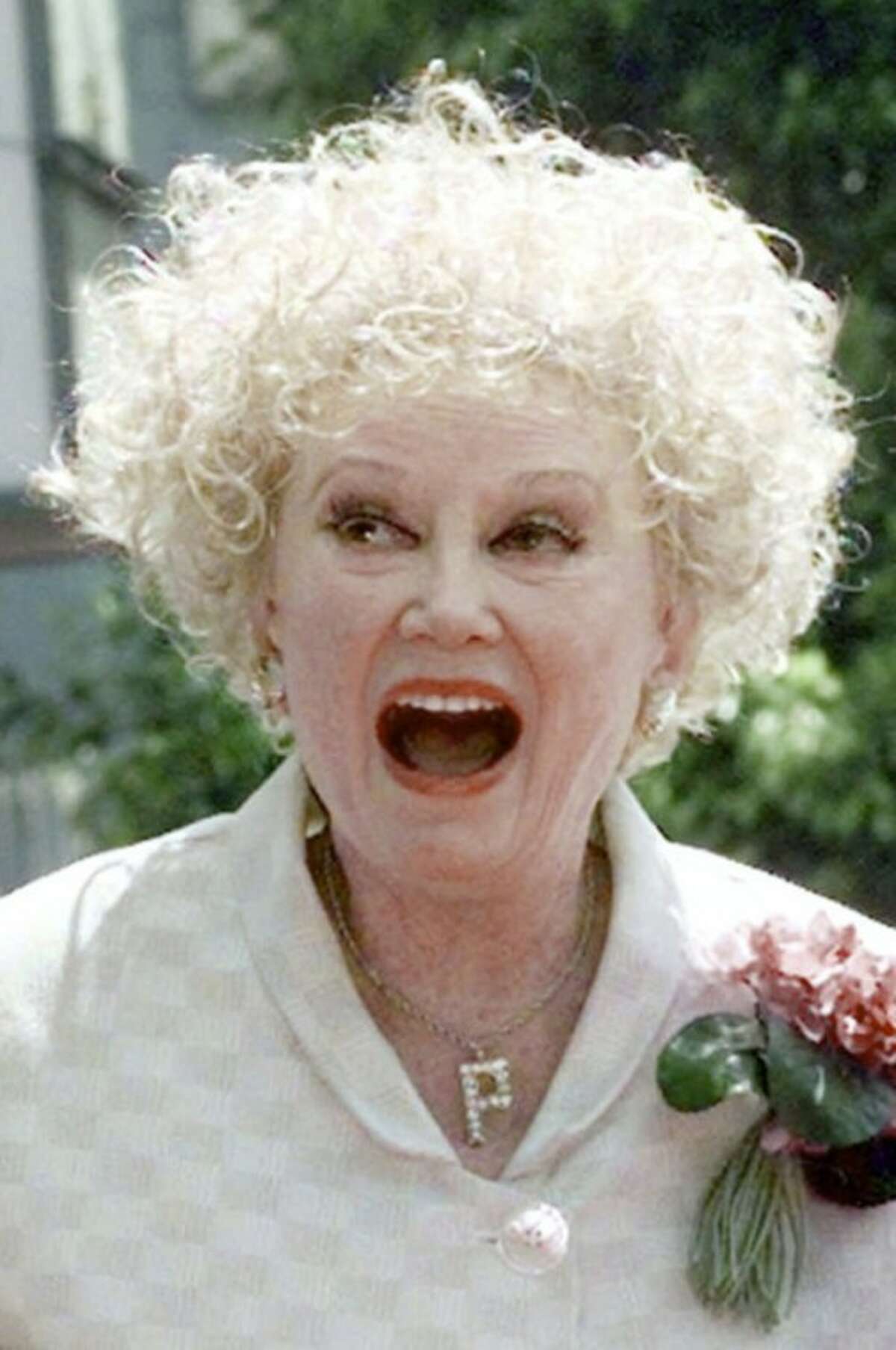 FILE-In this May 17, 1999 file photo, Phyllis Diller laughs in the Hollywood section of Los Angeles. Diller, the housewife turned humorist who aimed some of her sharpest barbs at herself, died Monday, Aug. 20, 2012, at age 95 in Los Angeles. (AP Photo/Nick Ut, File)