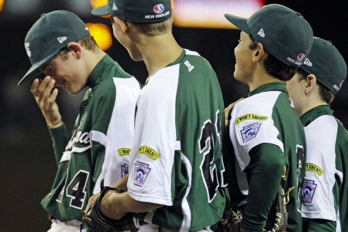 Fairfield, Conn., pitcher Will Lucas, left, reacts after pitching a no-hitter against New Castle, Ind., in an elimination baseball game at the Little League World Series tournament in South Williamsport, Pa., Monday, Aug. 20, 2012. Connecticut won 4-0. (AP Photo/Gene J. Puskar)