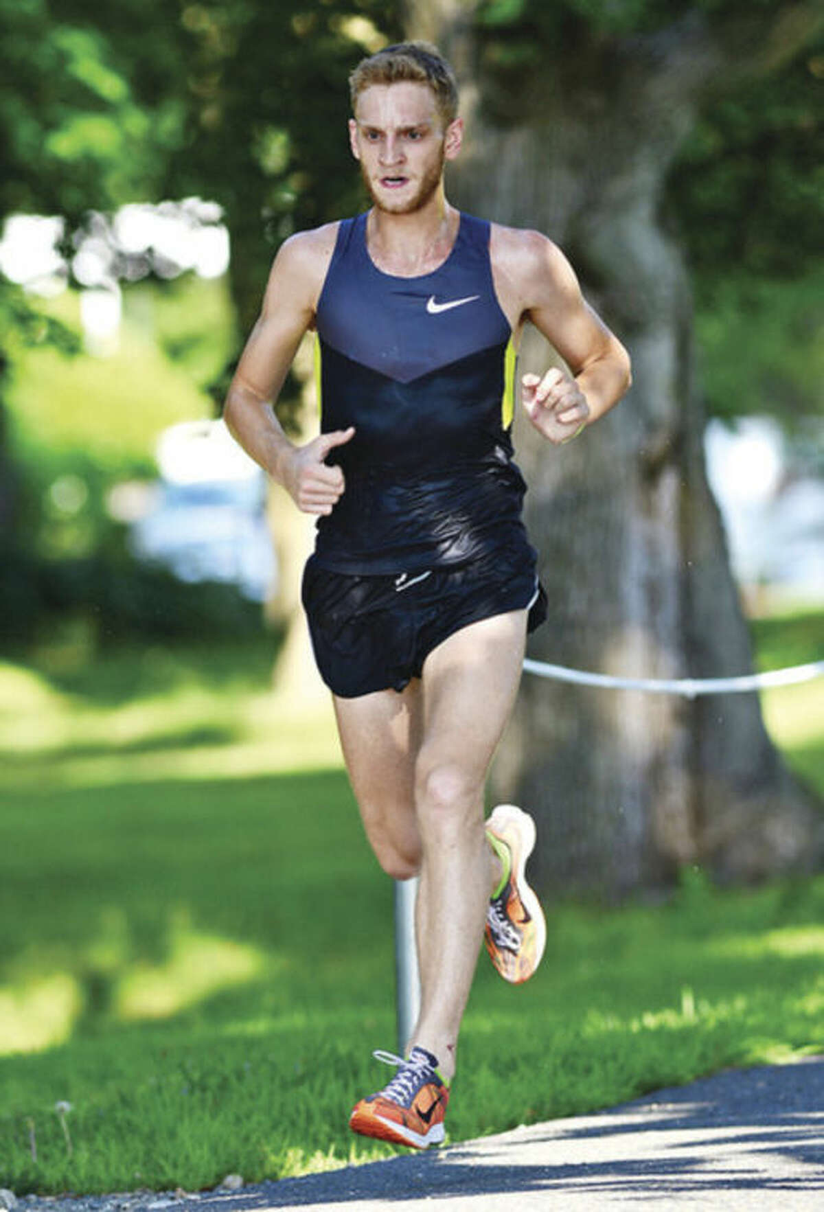 Hour photo/Erik Trautmann Luke McCambley is the first male finisher during the Westport Road Runners second race in a 10-race series at Longshore Park Saturday. Hour photo / Erik Trautmann