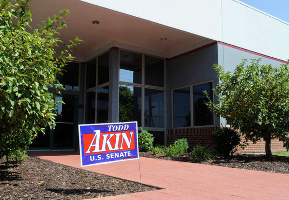 A campaign sign stands outside the Senate campaign office of U.S. Rep. Todd Akin, R-Mo., Tuesday, Aug. 21, 2012 in Chesterfield, Mo. Rep. Akin has come under pressure to abandon his Senate compaign after his comments that women's bodies can prevent pregnancies in cases of "legitimate rape". (AP Photo/Bill Boyce)