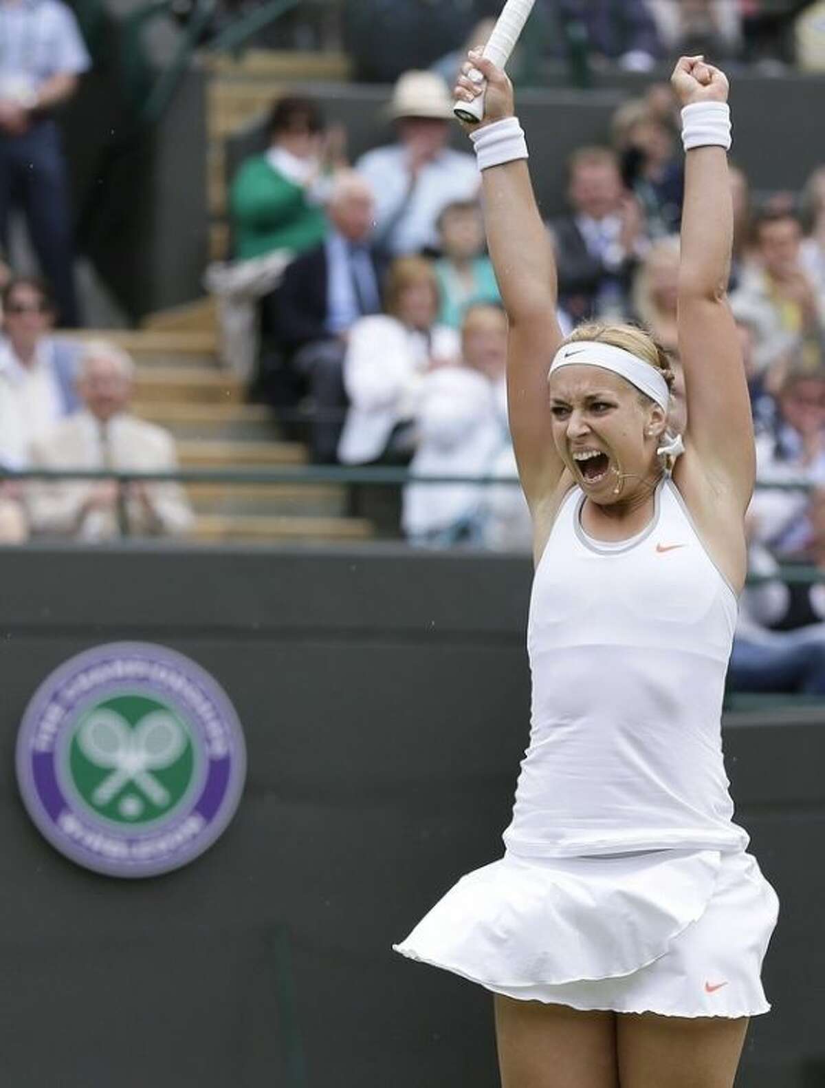 Sabine Lisicki of Germany reacts as she wins a Women's singles quarterfinal match against Kaia Kanepi of Estonia at the All England Lawn Tennis Championships in Wimbledon, London, Tuesday, July 2, 2013. (AP Photo/Alastair Grant)