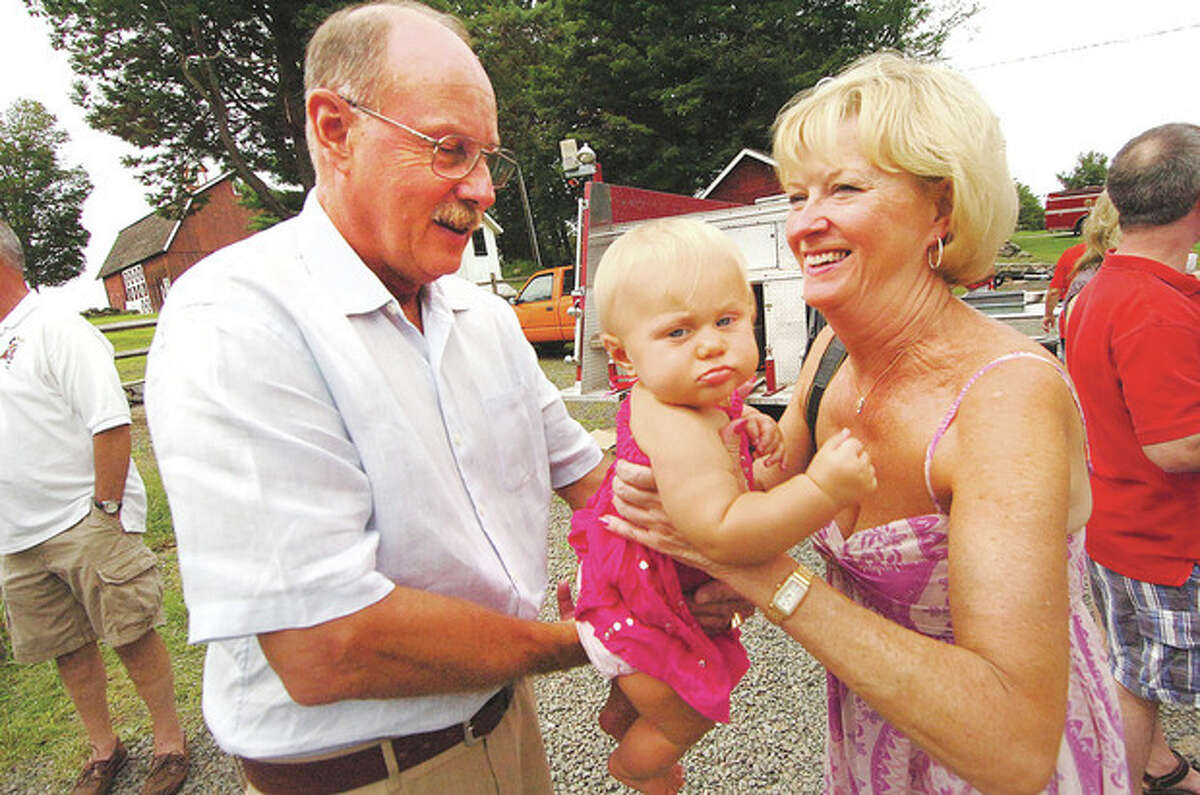Hour photo / Alex von Kleydorff After nearly 41 years of service for the Wilton Fire Department, Capt. Karl Dolnier will retire and will be able to spend more time with wife, Nancy, and 9-month-old granddaughter Payton Dolnier. Below, U.S. Sen. Richard Blumenthal shares a laugh with Dolnier.