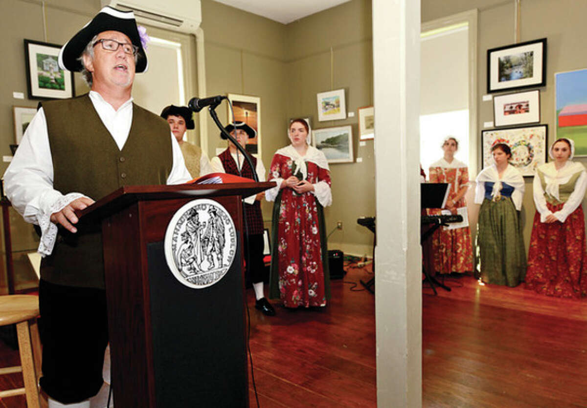 Hour photo / Erik Trautmann Town Clerk Rick McQaid reads the Declaration of Independence during the Norwalk Historical Society's Independence Day celebration at the Mill Hill complex Thursday.