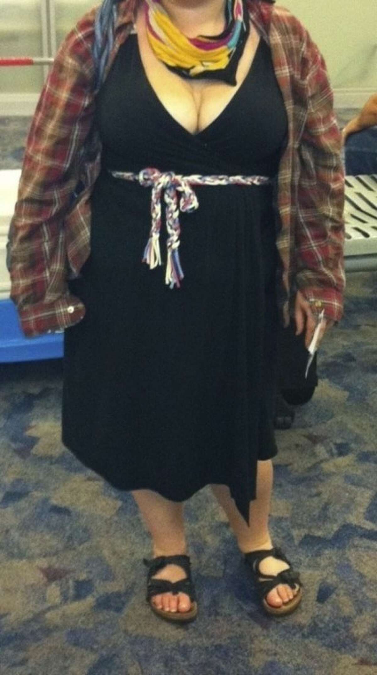 In this Spring 2012 photo provided by a woman identified as Avital and made available to the blog Jezebel, Avital poses for a picture at McCarran International Airport in Las Vegas, showing what she was wearing after she says a Southwest Airlines gate agent approached her, alleging she was showing too much cleavage. Airlines give many reasons for refusing to let you board, but none are stirring as much debate in 2012 than how a passenger is dressed. (AP Photo/Courtesy of Avital)