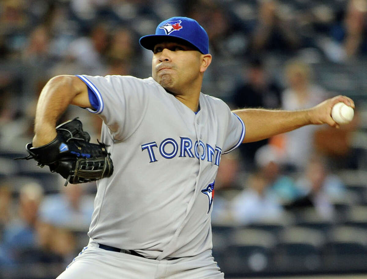 Toronto Blue Jays starting pitcher Ricky Romero throws against the New York Yankees in the second inning of a baseball game on Tuesday, Aug., 28, 2012, in New York. (AP Photo/Kathy Kmonicek)