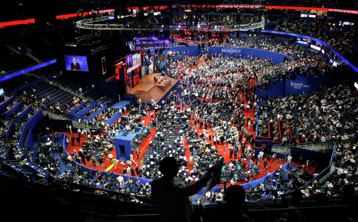 Delegates gather in the Tampa Bay Times Forum during the Republican National Convention in Tampa, Fla., on Tuesday, Aug. 28, 2012. (AP Photo/Jae C. Hong)