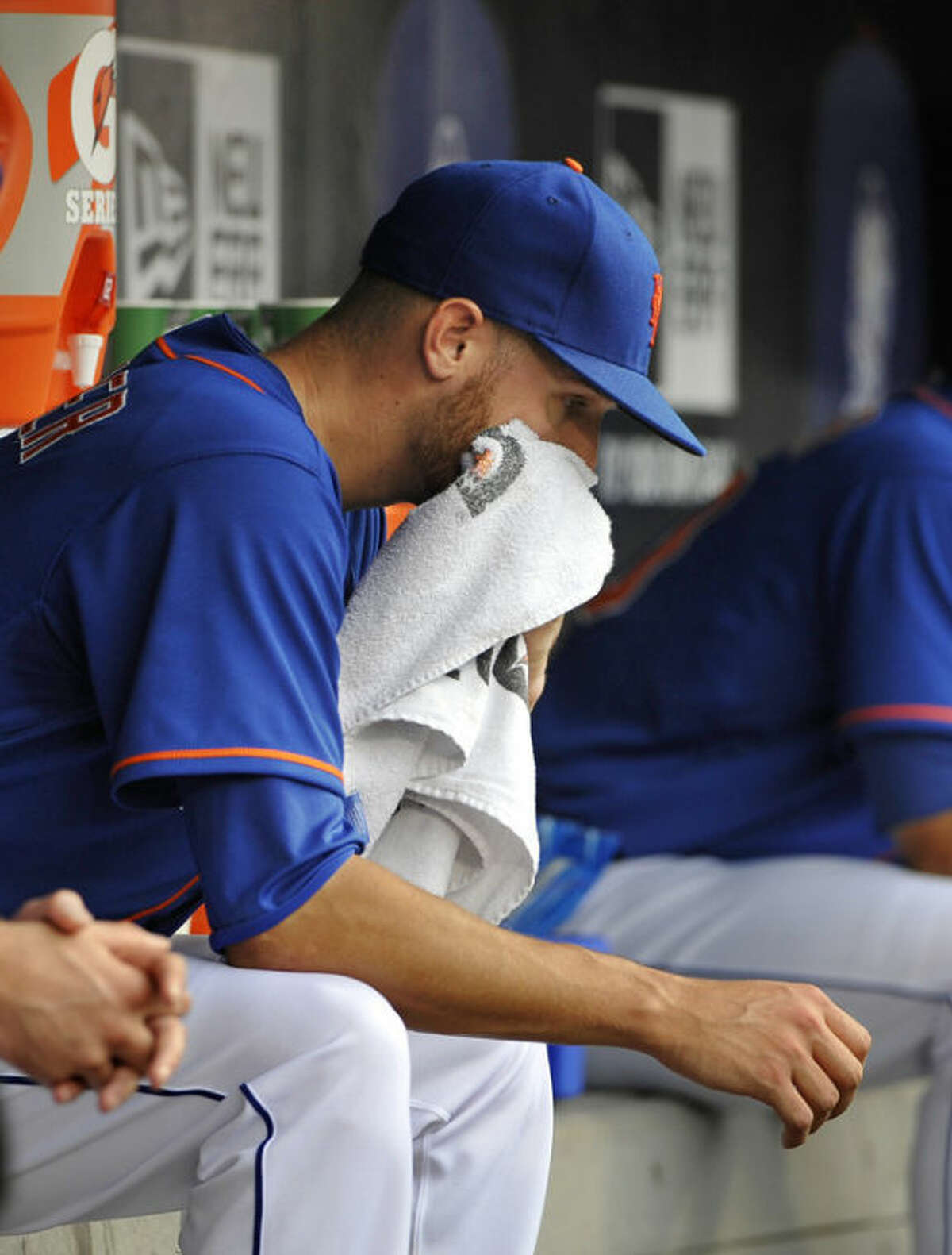 New York Mets starting pitcher Zack Wheeler sits in the dugout after being taken out of the baseball game against the Washington Nationals in the fifth inning at Citi Field on Sunday, June 30, 2013 in New York. (AP Photo/Kathy Kmonicek)