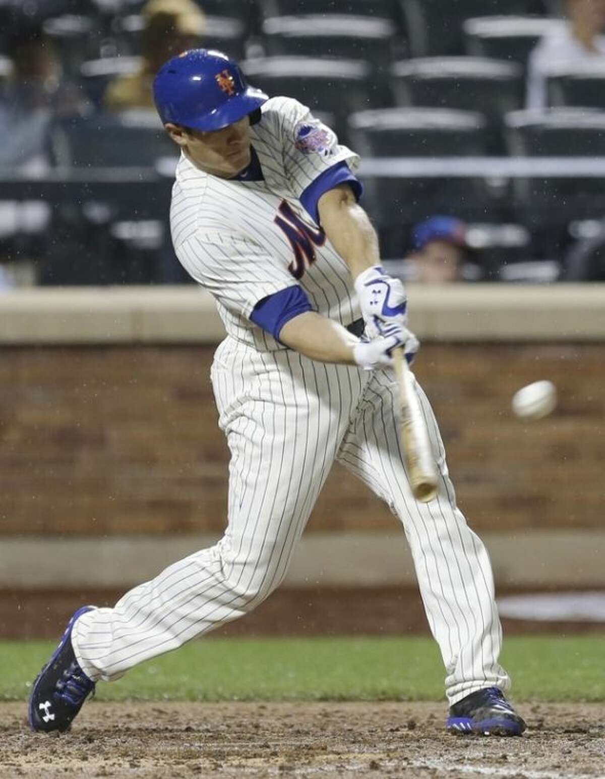 New York Mets' Anthony Recker hits a home run during the fifth inning of a baseball game against the Arizona Diamondbacks Tuesday, July 2, 2013, in New York. (AP Photo/Frank Franklin II)