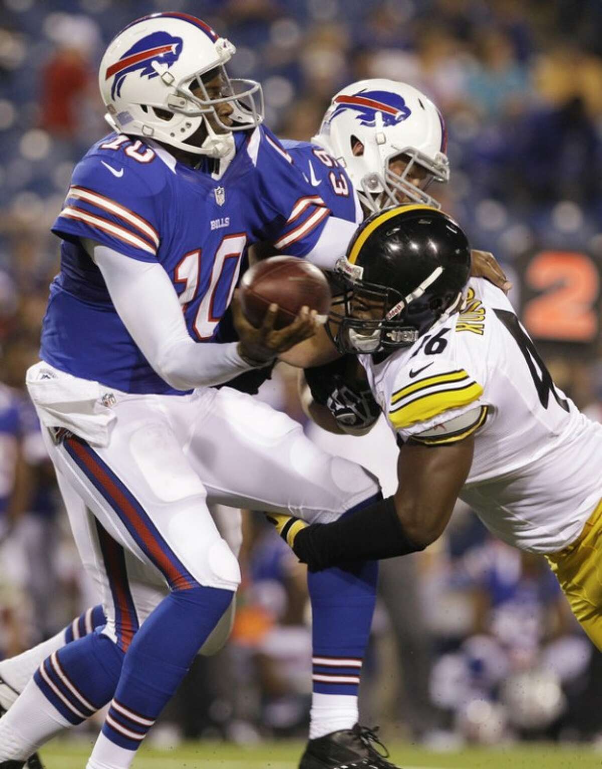 Buffalo Bills' Vince Young is pressured by Pittsburgh Steelers' Adrian Robinson (46) during the second half of a preseason NFL football game in Orchard Park, N.Y., Saturday, Aug. 25, 2012. (AP Photo/Doug Benz)