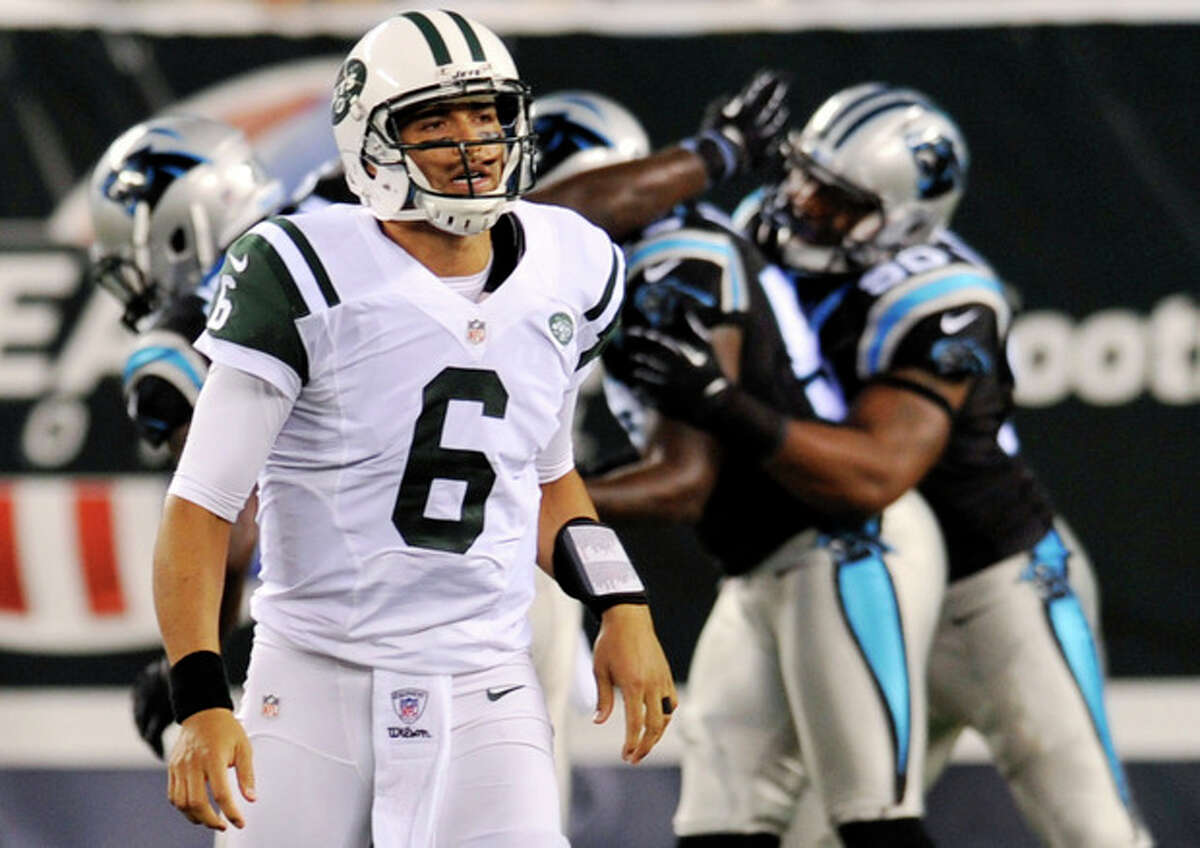 New York Jets quarterback Mark Sanchez (6) reacts as the Carolina Panthers defense celebrates a sack during the first half of a preseason NFL football game, Sunday, Aug. 26, 2012, in East Rutherford, N.J. (AP Photo/Bill Kostroun)