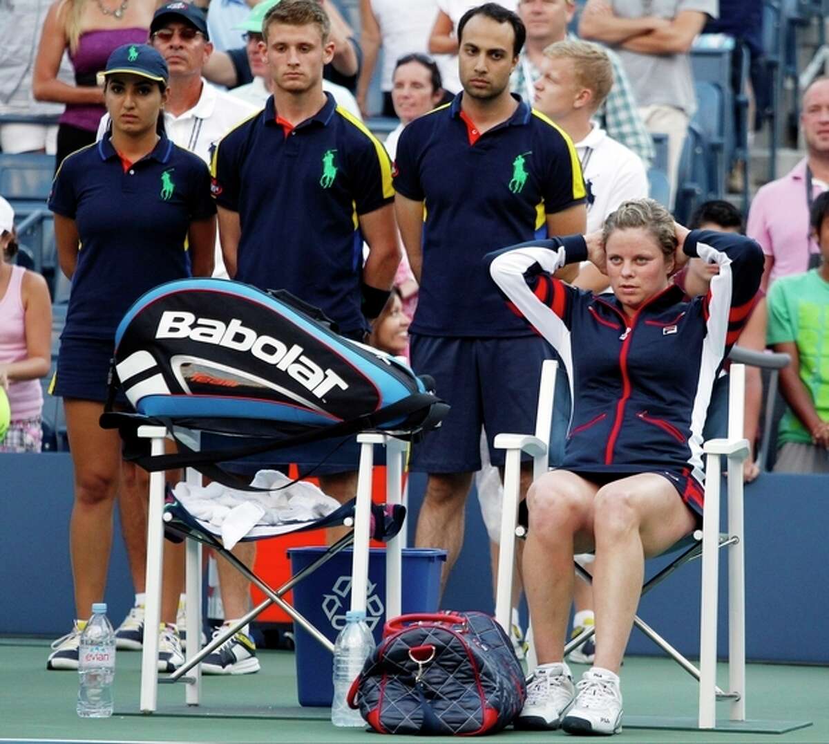 Kim Clijsters of Belgium sits on the side of the court after losing to Laura Robson of Great Britain in the second round of play at the 2012 US Open tennis tournament, Wednesday, Aug. 29, 2012, in New York. (AP Photo/Mel C. Evans)